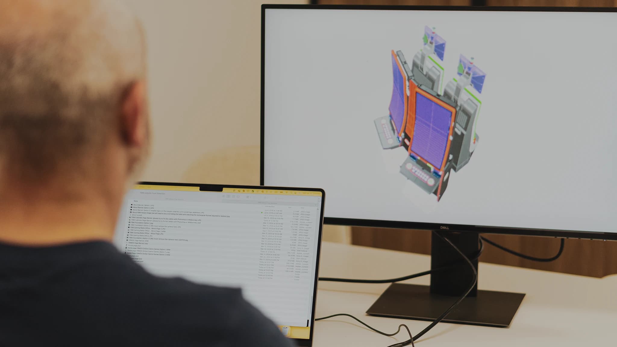 A professional working on a software and refining one of the FBM casino cabinets model