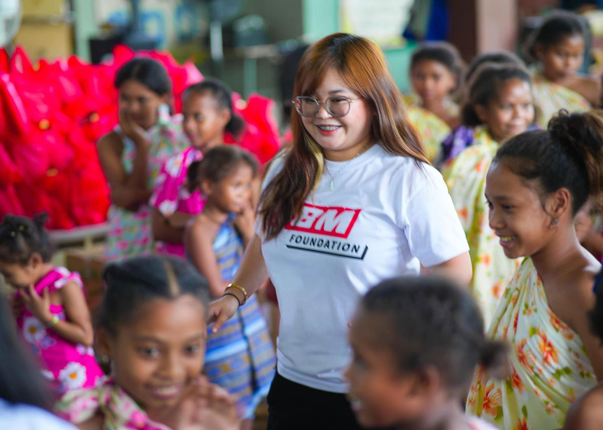 Lulu Barreras playing with the kids from St. Francis Learning Center Foundation, Inc