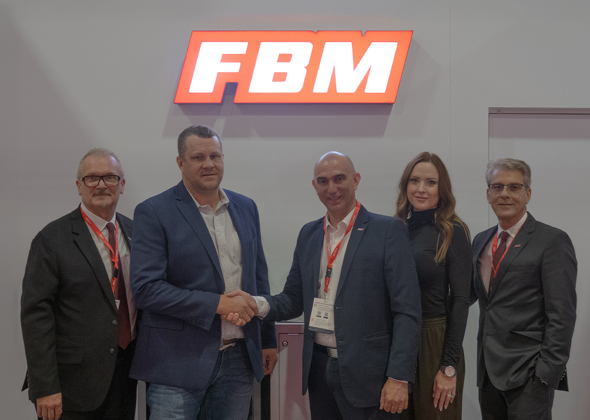 The image shows the FBM and Delta Gaming Solutions representatives after signing the distribution agreement for Oklahoma.