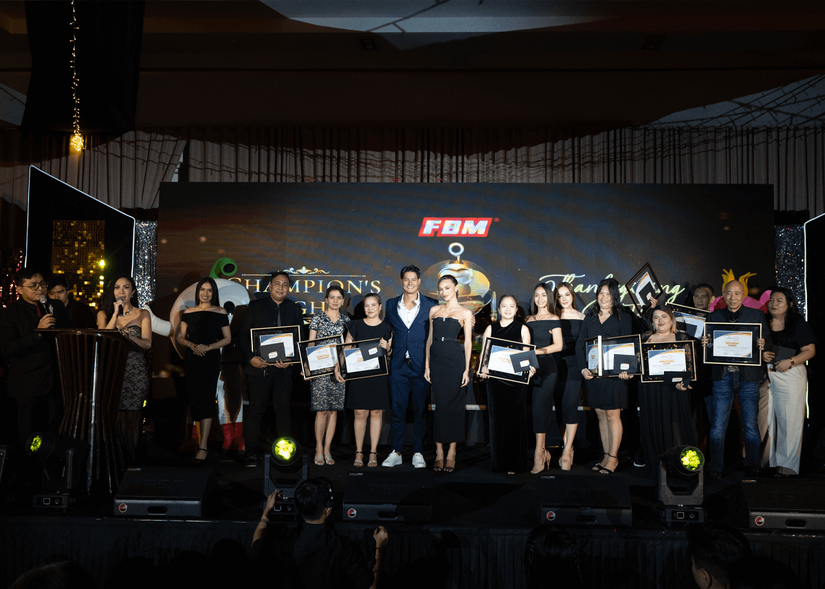 The image shows several bingo operators on stage with the duo of hosts of FBM Champion's Night