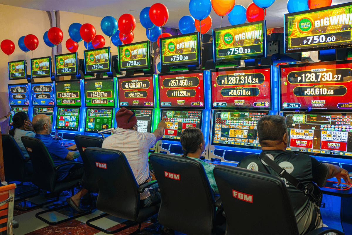 Multiple casino cabinets with FBM video bingos running and players actively enjoying the games.